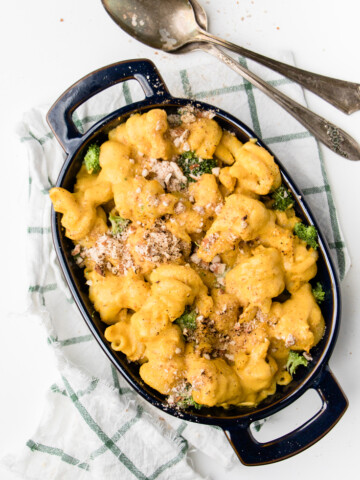 a black skillet filled with dairy free mac and cheese.