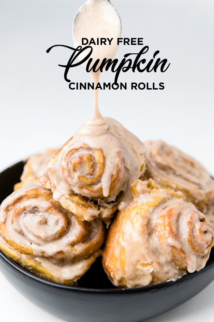 the words dairy free pumpkin cinnamon rolls overlayed onto a bowl of cinnamon rolls.