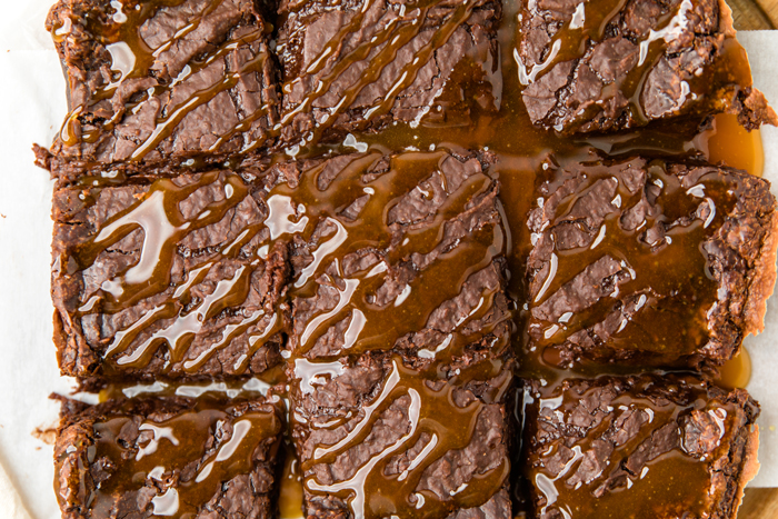 tops of dairy free brownies drizzled with caramel and cut into squares.