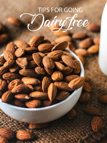 the words tips for going dairy free across a bowl of almonds.