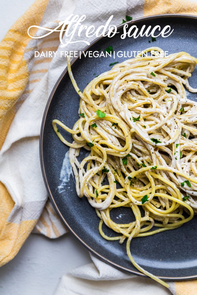 the words alfredo sauce dairy free vegan gluten free overlayed across a plate of pasta.