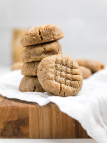a stack of vegan peanut butter cookies.