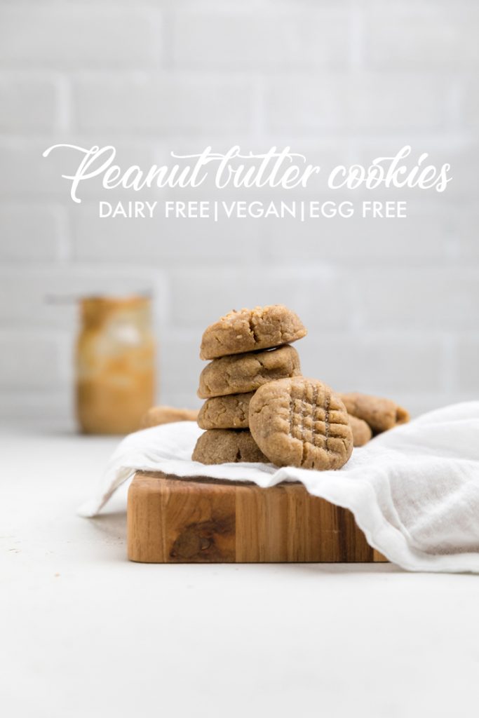 the words peanut butter cookies dairy free vegan egg free overlayed onto a stack of cookies.