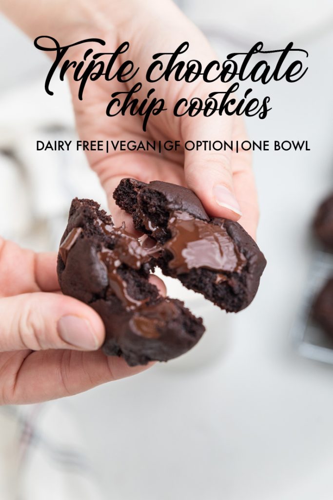 the words triple chocolate chip cookies dairy free vegan overlayed onto a cookie being broken apart.
