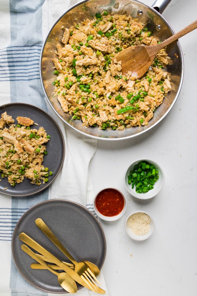 a skillet and plate of vegan chicken fried rice.