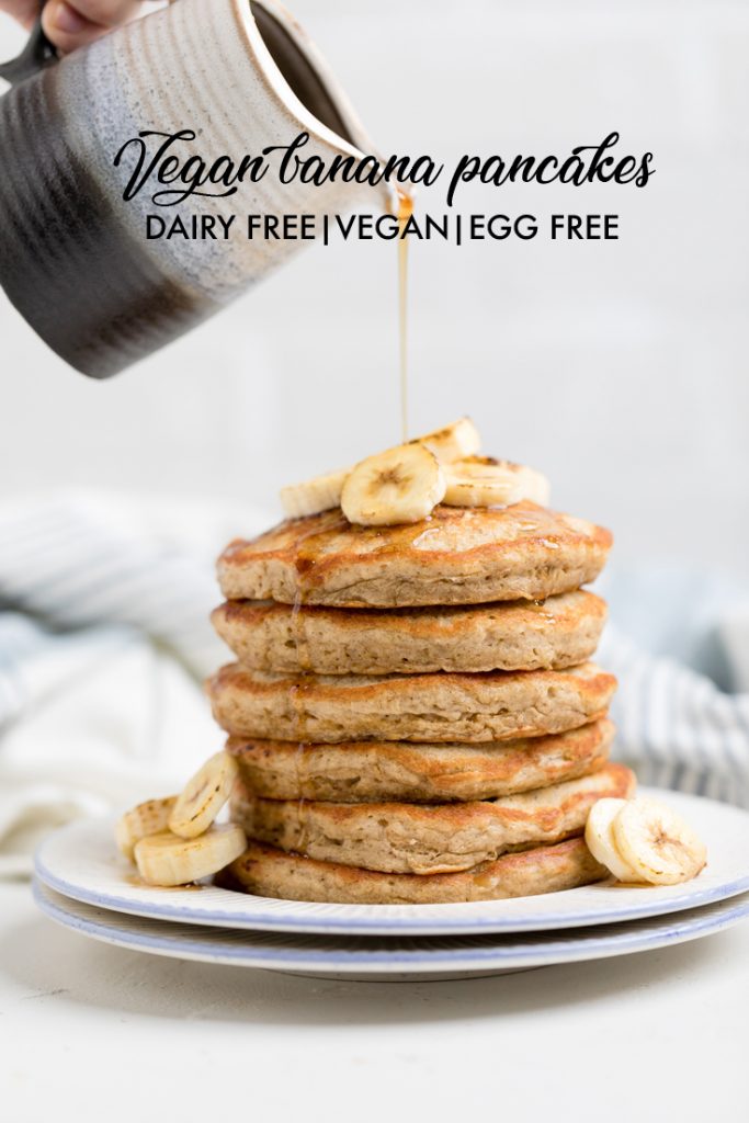the words vegan banana pancakes overlayed onto a plate of pancakes.