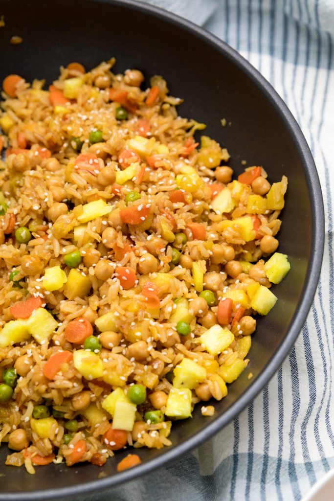 a skillet with vegan pineapple fried rice.