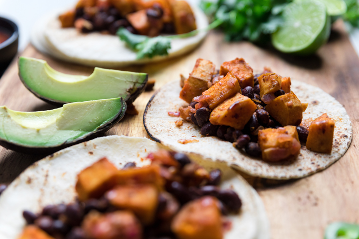 two cooked vegan sweet potato and black bean tacos.