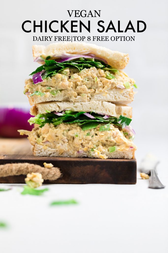 a vegan chickpea chicken salad sandwich with red onions and lettuce.