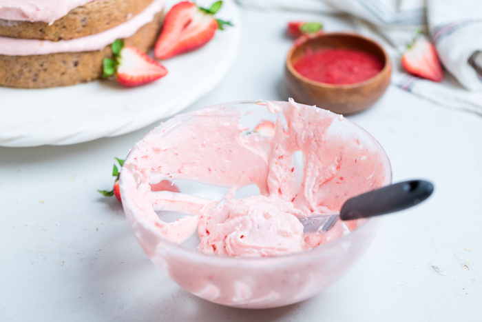 a bowl of vegan strawberry buttercream.