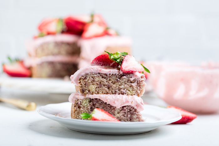 a slice of double layered vegan strawberry cake.