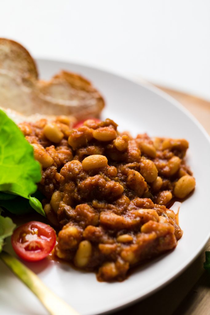 cooked vegan baked beans on a plate.