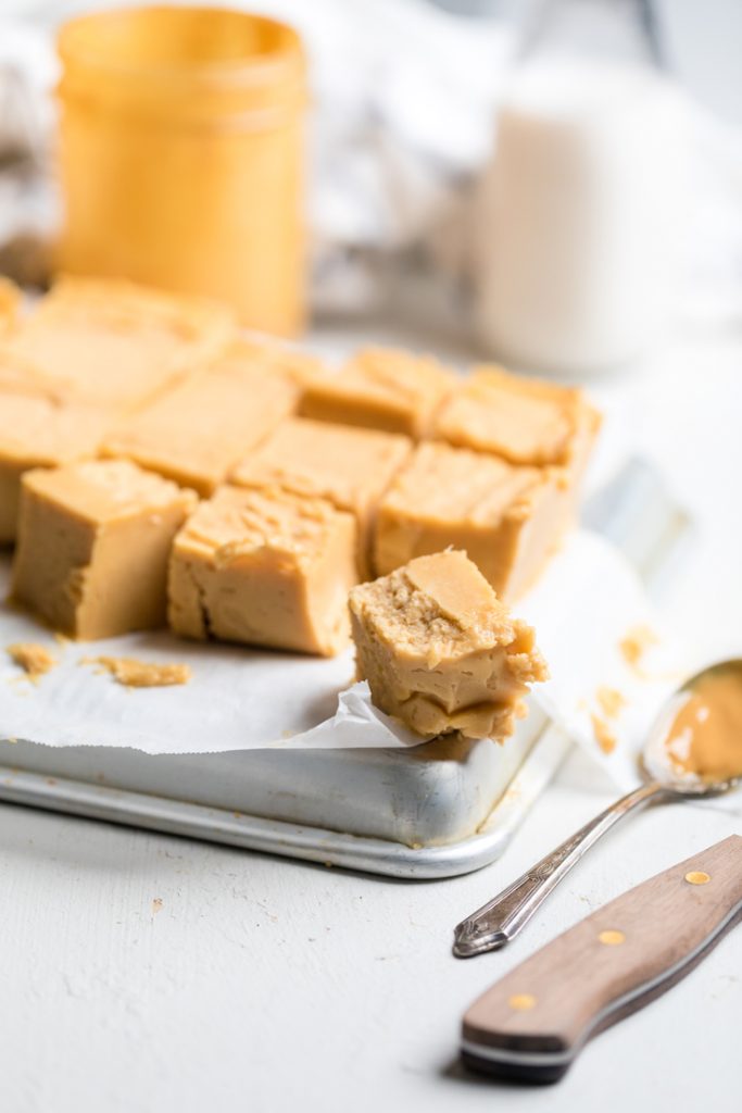 a batch of vegan peanut butter fudge on a tray.