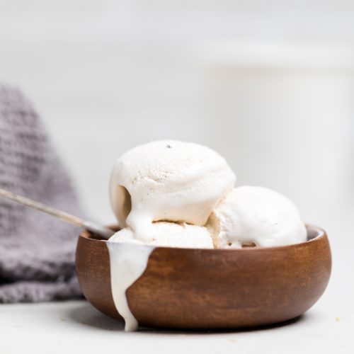a bowl of vegan vanilla ice cream melting.