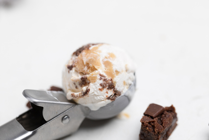 a scoop of vegan salted caramel brownie ice cream.