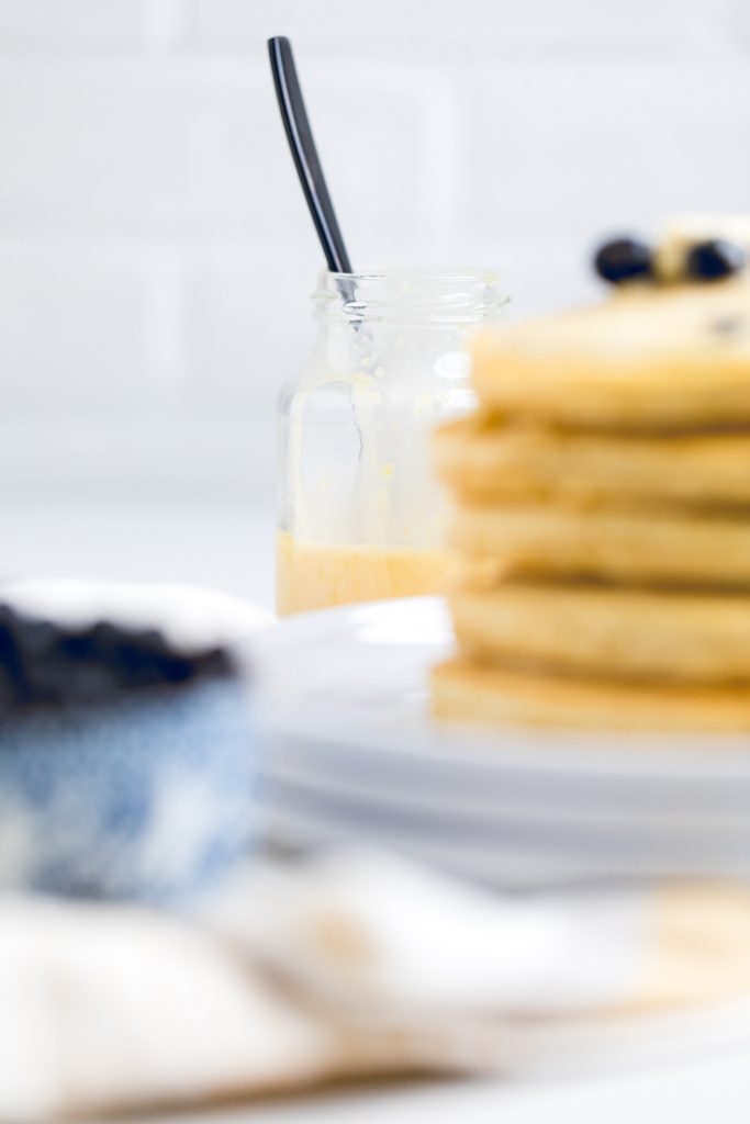 pancakes and jar of lemon glaze drizzle. 