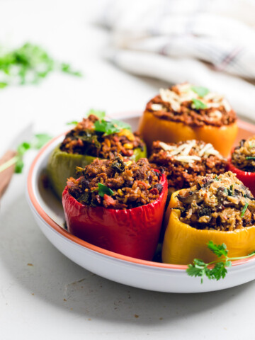 a bowl of a stuffed peppers with a variety of fillings.