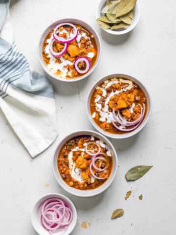three bowls of vegan sweet potato chili.