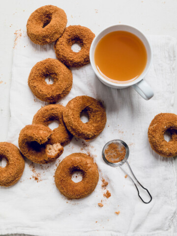 easy baked vegan apple cider donuts on a table.