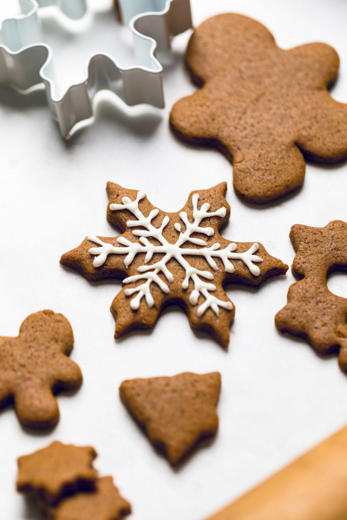 a frosted snowflake cutout vegan gingerbread cookie.