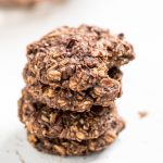 A stack of healthy vegan chocolate peanut butter banana oatmeal cookies.