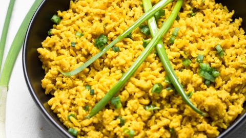 A bowl of Instant Pot vegan garlic turmeric rice.