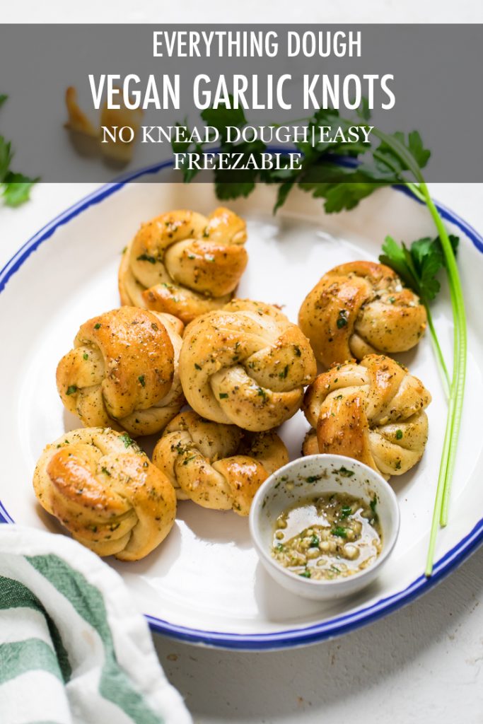 The words everything dough vegan garlic knots overlayed onto a plate.