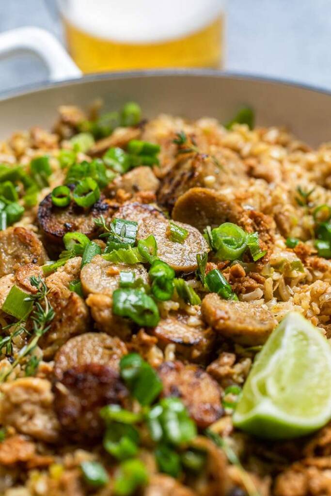 Instant pot vegan dirty rice with green onions overtop.