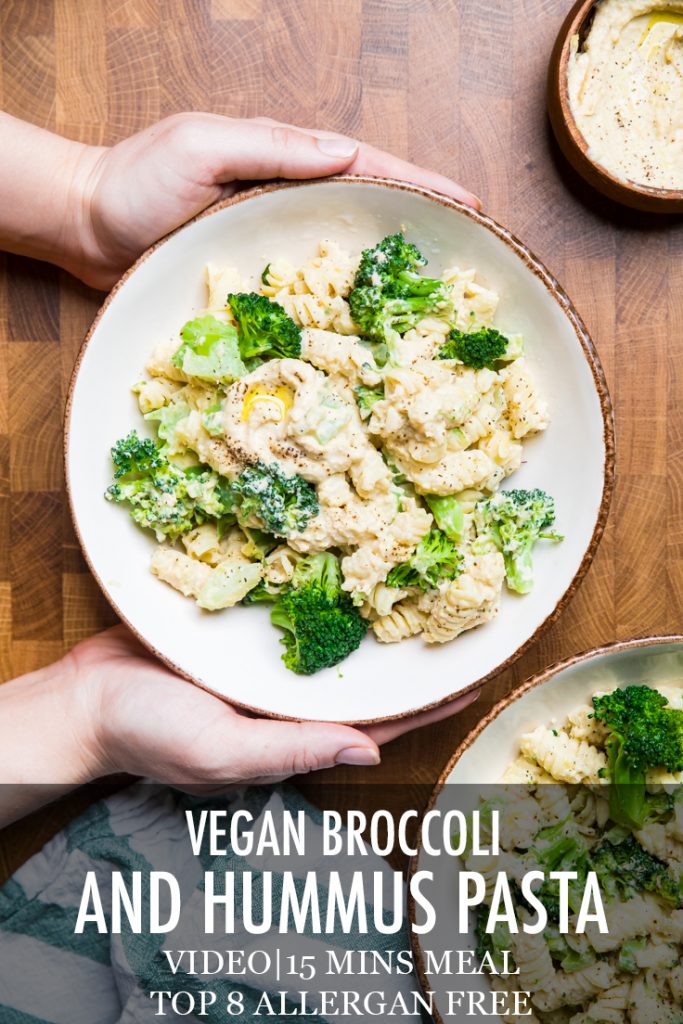 The words vegan broccoli and hummus pasta overlayed onto a bowl of pasta.