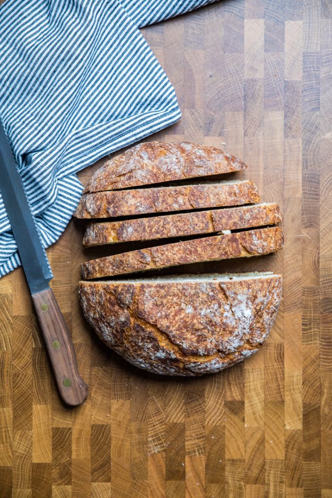 A loaf of vegan artisan bread sliced.