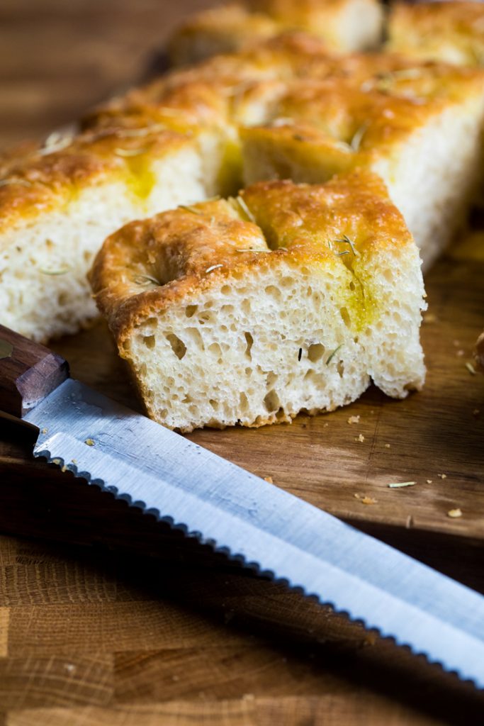 A square of vegan focaccia bread to show fluffy texture.