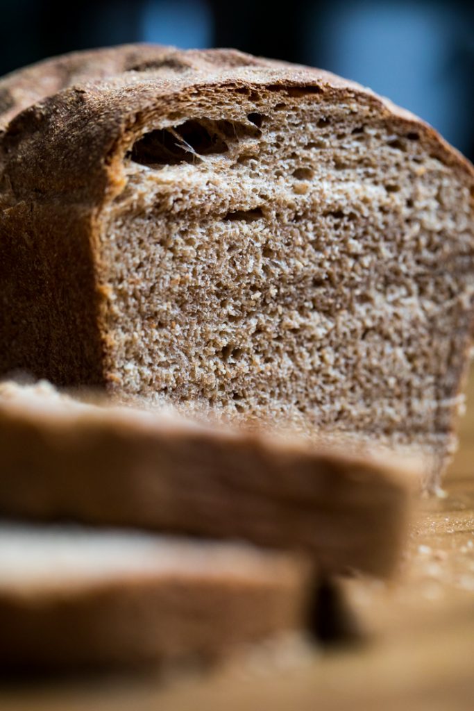 Inside of easy vegan whole wheat bread loaf to show fluffy texture.