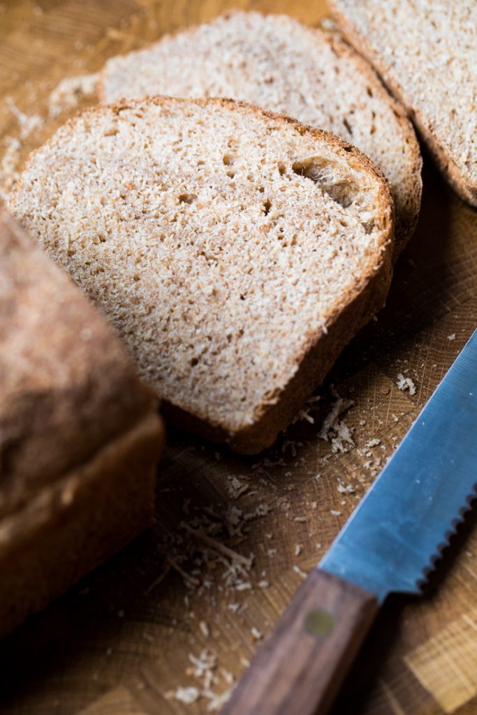 A slice of easy vegan whole wheat bread.