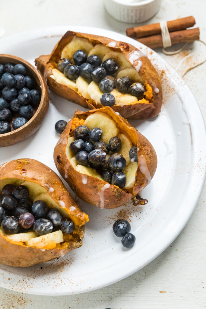 Cooked Sweet Potatoes with bananas and blueberries.