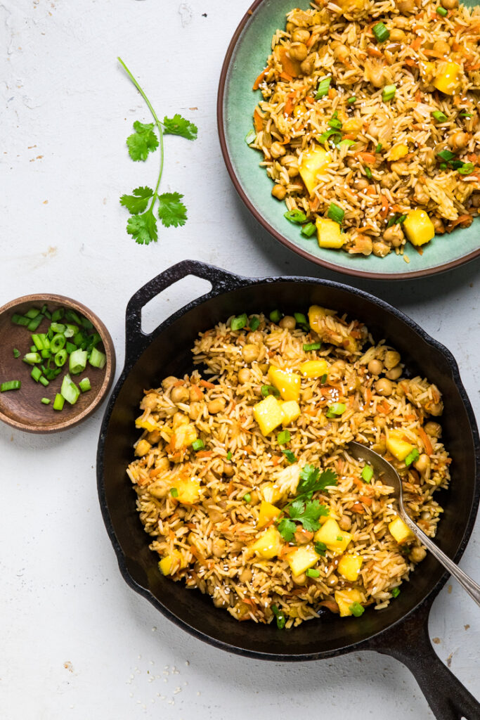 Cooked vegan mango fried rice in a skillet. 