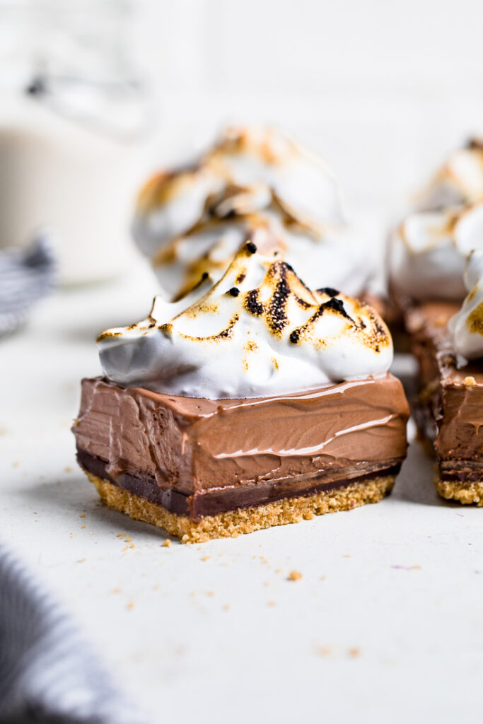 A piece of No Bake Vegan S\'mores with Dark Chocolate Mousse topped with aquafaba whip.