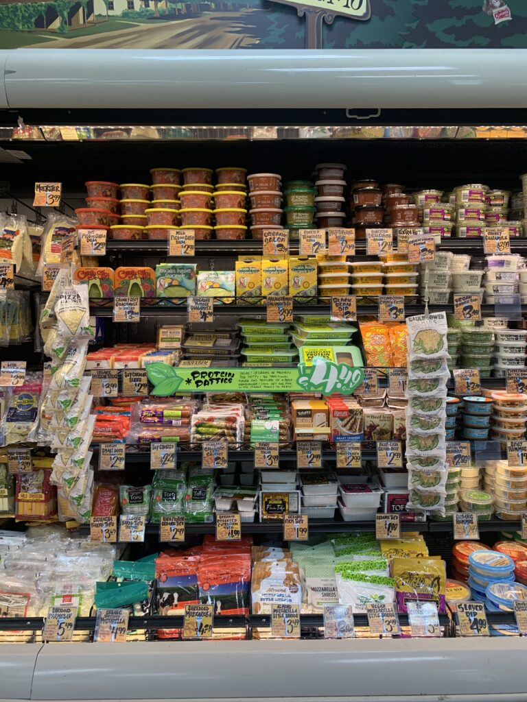 A Trader Joe\'s store aisle with vegan products.