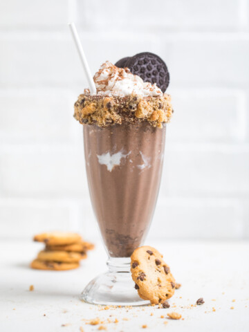A vegan chocolate cookies and cream milkshake on a table.