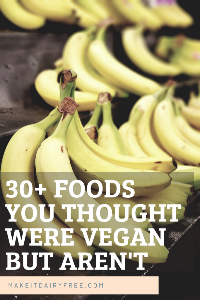 A shelf of bananas with the words foods you thought were vegan but they\'re not overlayed.