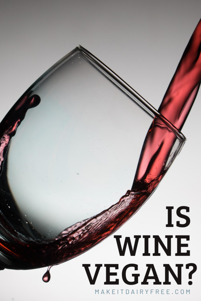 The words Is wine vegan overlayed onto wine being poured into a glass. 
