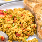 A plate of Easy vegan tofu scramble with green onions.