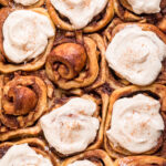 Tops of Vegan Apple Pie Cinnamon Rolls with Cream Cheese Spice Frosting.