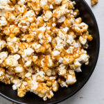 A bowl of vegan caramel popcorn.