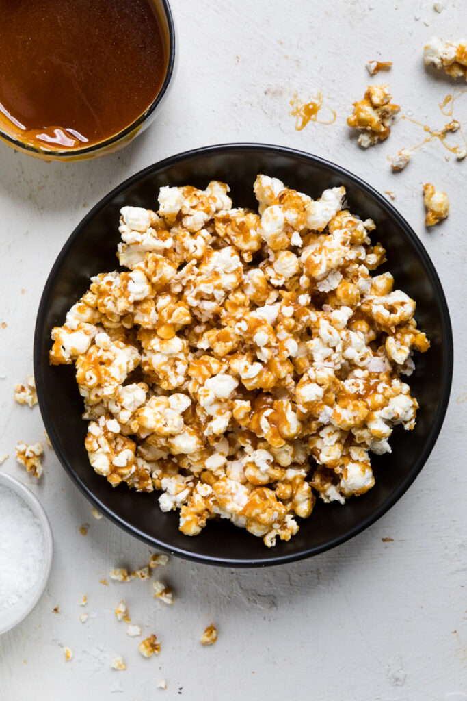 A serving bowl of vegan caramel popcorn.