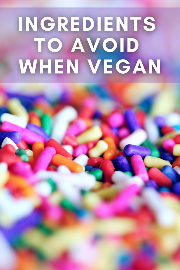 A bunch of sprinkles with the words food ingredients to avoid when vegan overlayed.