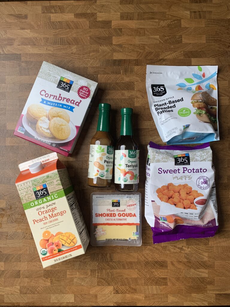 A group of vegan 365 products on a wooden table.