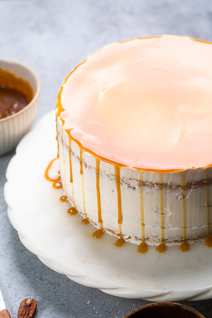 A double layer of frosted Vegan Caramel Cake topped with caramel drizzle. 