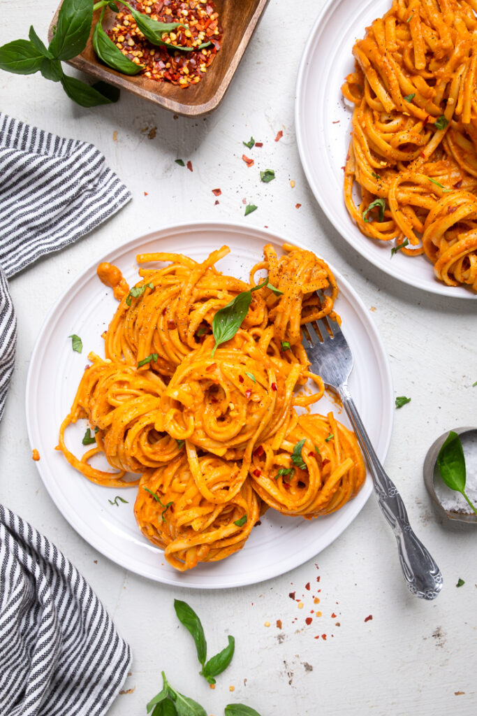 Plates of Vegan Roasted Red Pepper Pasta.