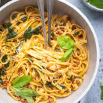 A pot of Easy 30 minute Vegan Spinach and Sundried Tomato Pasta.