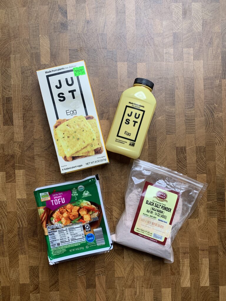 Just Egg folded and liquid egg products, black salt and a package of tofu.